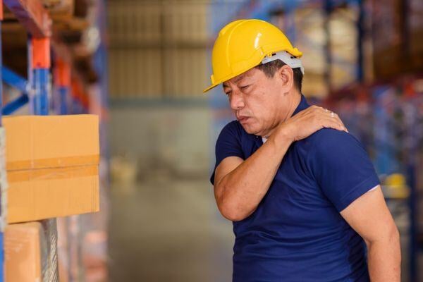 Warehouse worker with back pain